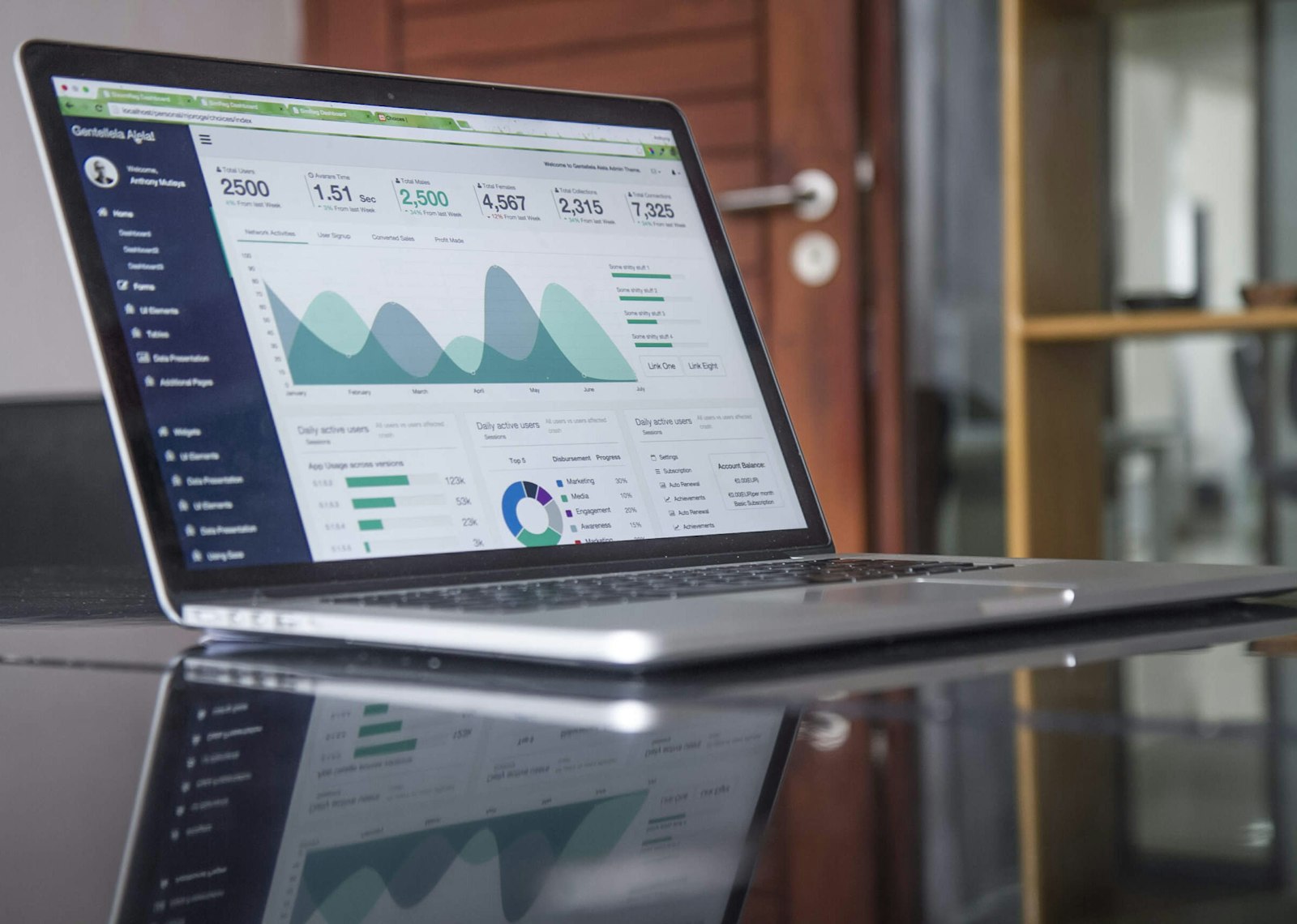 Professional configuring business email accounts on a laptop